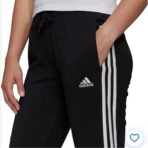 Adidas Black and White Sweatpants with Iconic Stripes